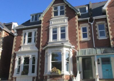 Residential building with cars parked outside